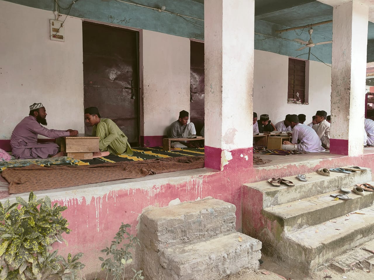 Jamia Usmania college sports ground with students playing football and cricket