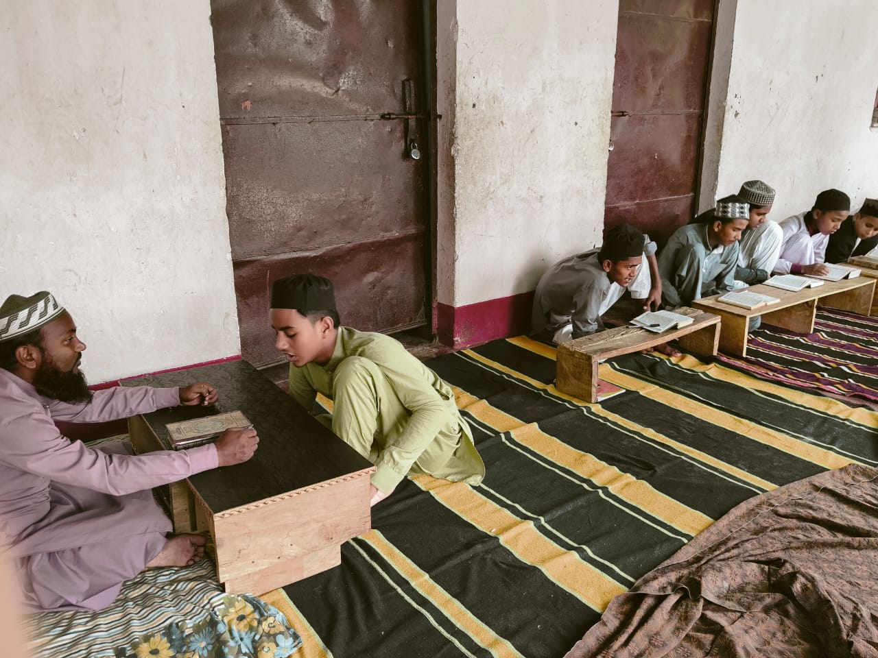 Jamia Usmania college auditorium with stage and seating for events