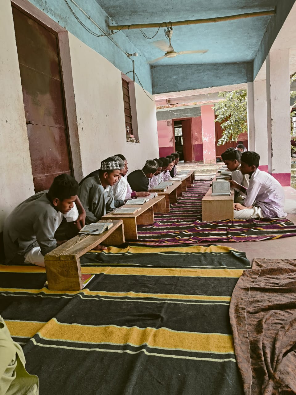 Beautiful garden area on Jamia Usmania campus with benches and flowering plants